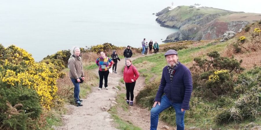 Dublin: Dublin Coastal Hike and Pints & Puppies - Castle stories on the way to the dramatic viewpoints