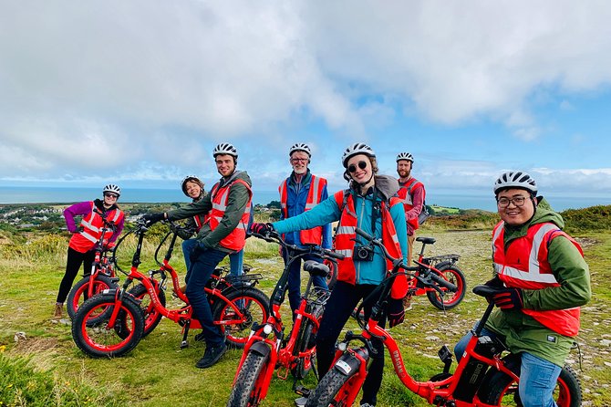 Dublin Panoramic e-Bike Tour with Howth Adventures - Howth Harbour piers and the lighthouse approach