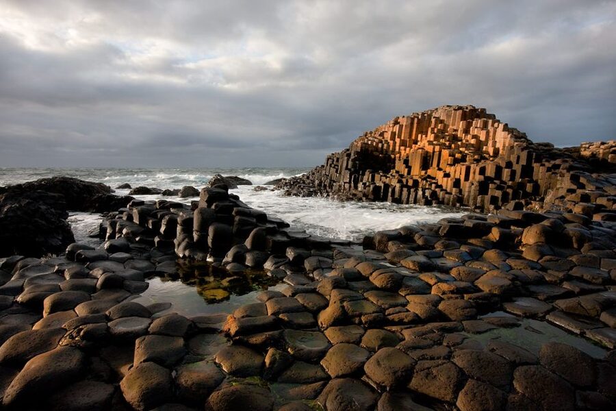 From Dublin: Belfast and Giant's Causeway: 2-Day Guided Tour - Dunluce Castle cliff ruins and MacDonnell clan setting